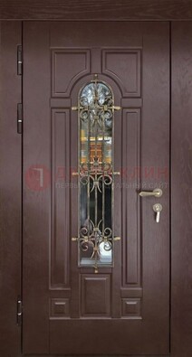 Темная железная дверь со стеклом и ковкой для частного дома ДСК-156 в Апрелевке